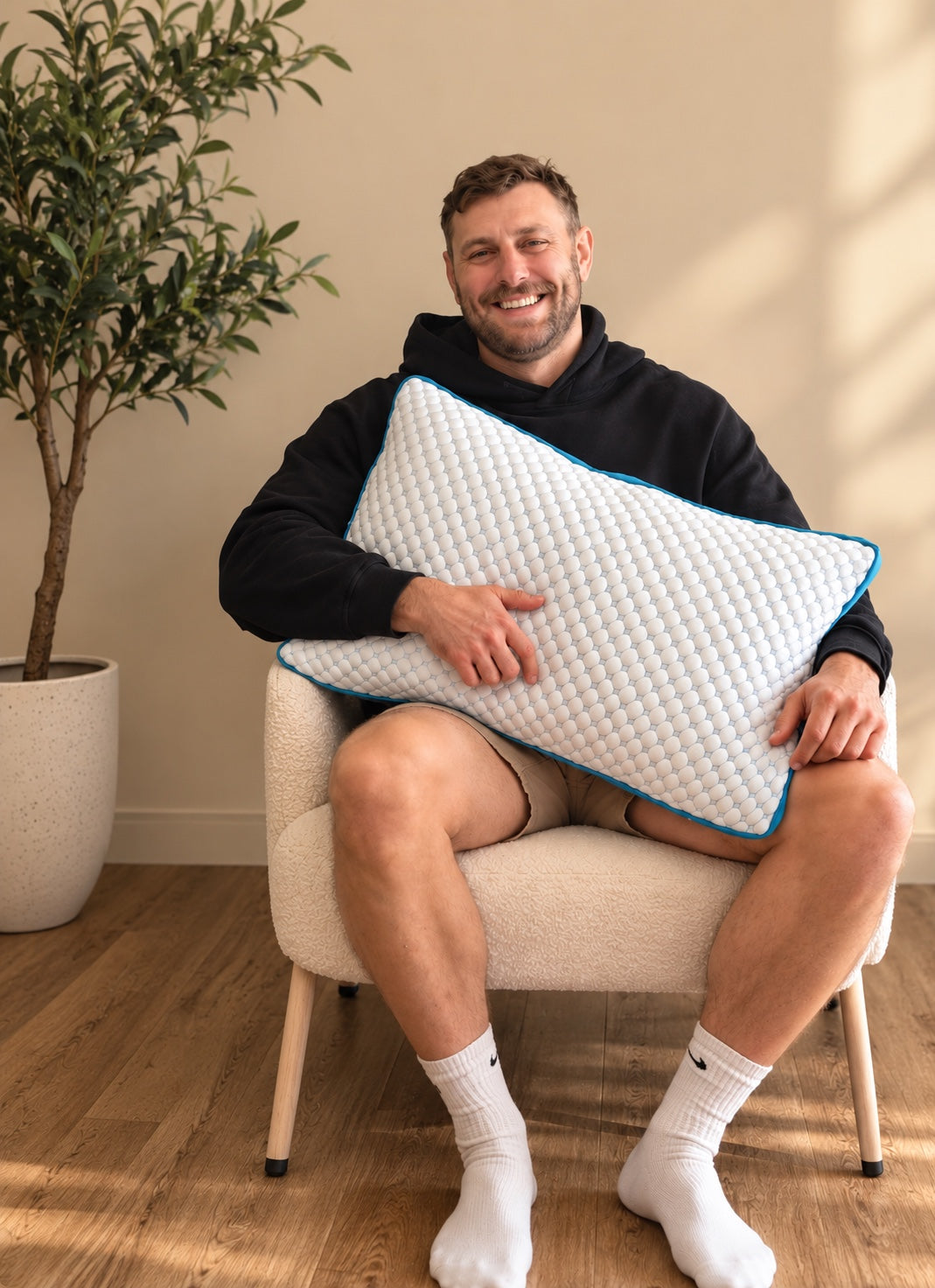 Nicholas, founder of Polar Sleep Co., holding the Polar Pillow